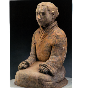 Notecard featuring a weathered seated statue in traditional attire with long sleeves, hands on knees, and blurred face; rustic texture against a dark background.