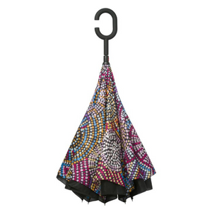 Image of the folded Invert Umbrella with artwork by Tina Martin