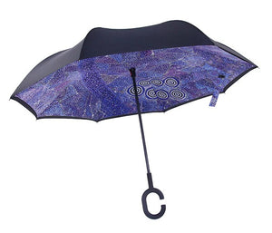 Side view image of Invert Umbrella with artwork by Alma Granites showing open umbrella