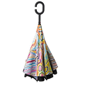Image of the Invert Umbrella with artwork by Judy Watson showing the folded umbrella