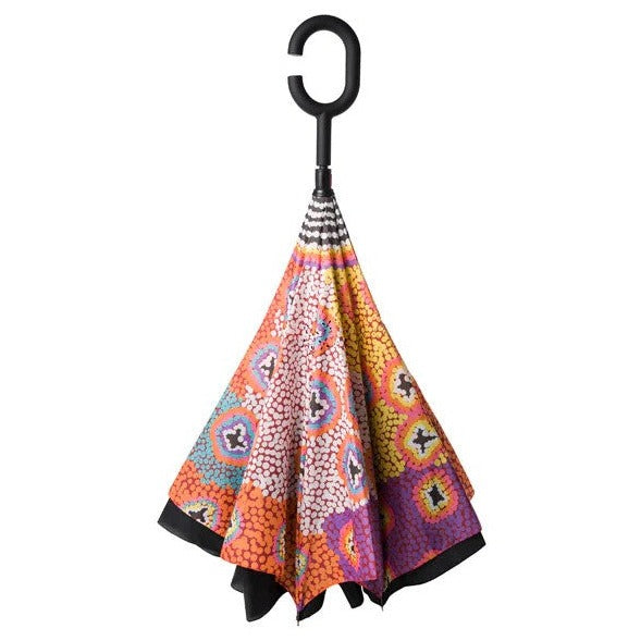 Image of the Invert Umbrella with artwork by Ruth Stewart, showing folded umbrella