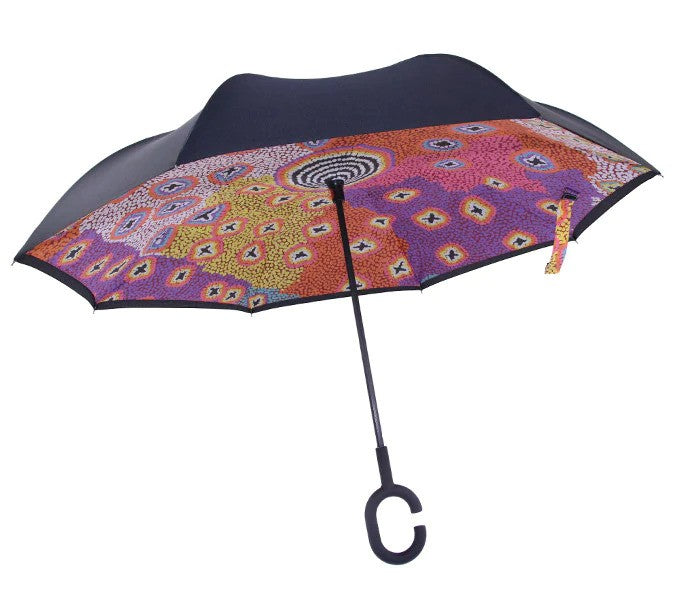 Side view of the Invert Umbrella with artwork by Ruth Stewart. Umbrella is open.