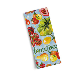 Folded kitchen towel with painted tomatoes and the word "tomatoes" on a light blue background.