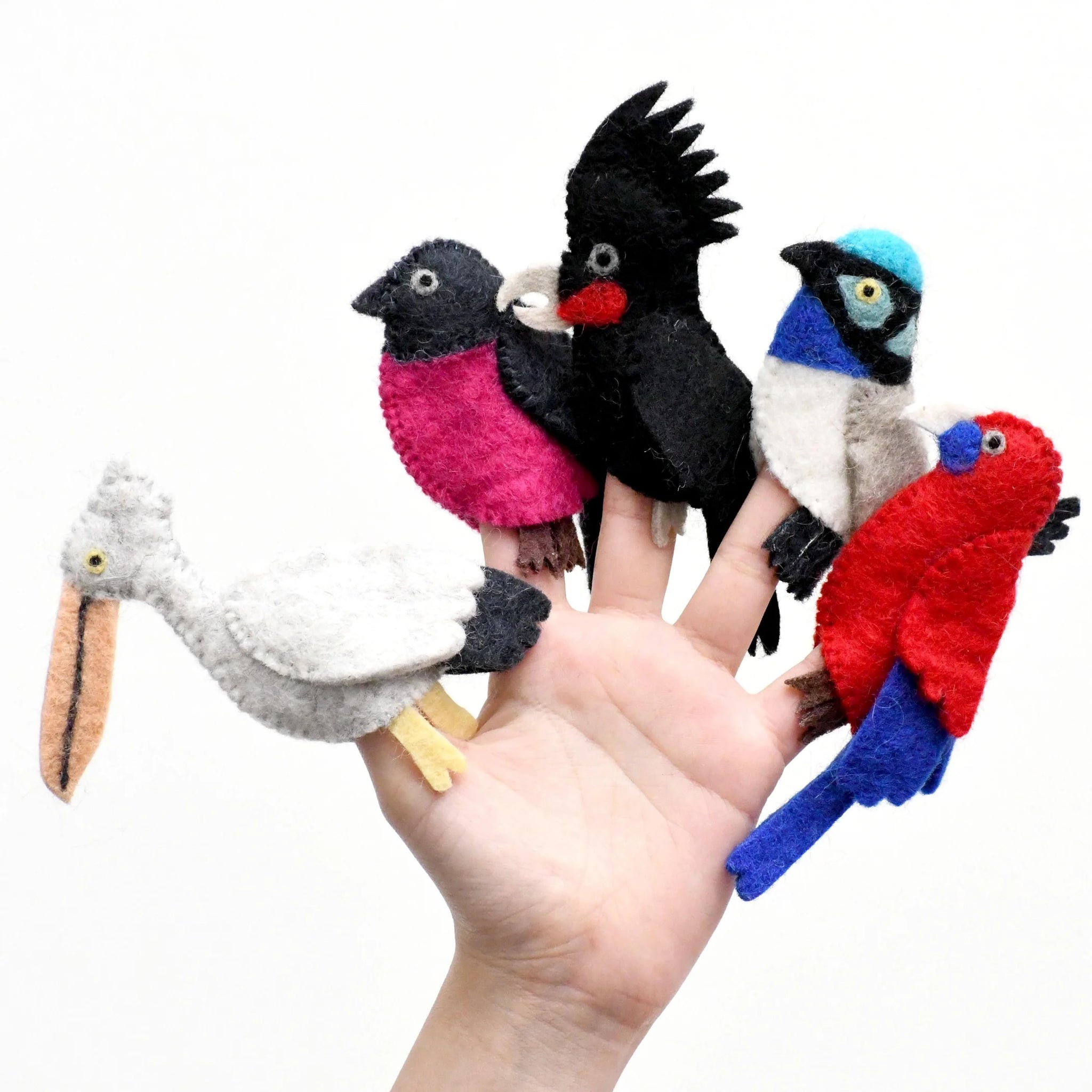 Image of Australian Bird Finger Puppets on hand on white background