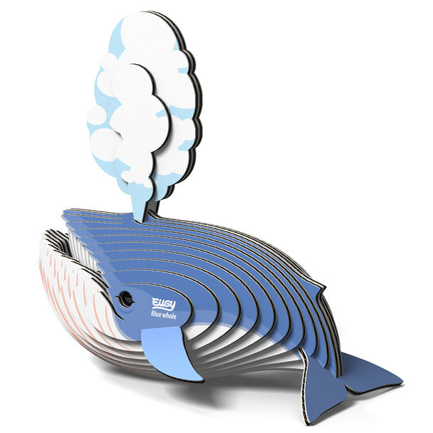 3D cardboard model of a blue whale in blue and white layers, with a water spout on top and 'Eugy Blue Whale' printed on the side.